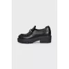 Leather loafers with silver decor
