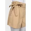 Beige shorts with a belt