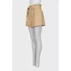Beige shorts with a belt