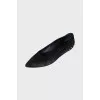 Black ballet flats with gold trim