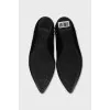 Black ballet flats with gold trim