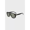 Green sunglasses with spotted frames