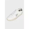 White leather sneakers with branded embroidery
