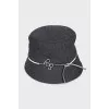 Gray panama hat decorated with a cord