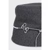 Gray panama hat decorated with a cord