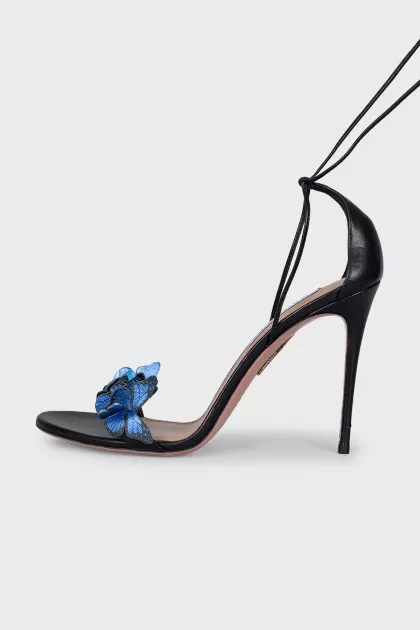 Leather sandals decorated with butterflies