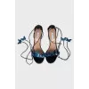 Leather sandals decorated with butterflies