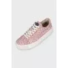 Pink sneakers with a signature print