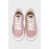 Pink sneakers with a signature print