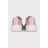 Pink sneakers with a signature print