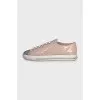 Patent leather sneakers with a metal toe cap