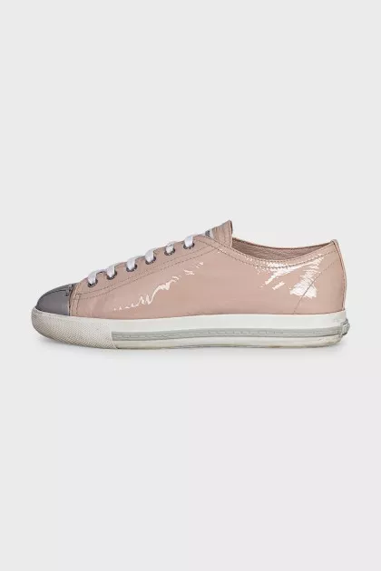 Patent leather sneakers with a metal toe cap
