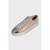 Patent leather sneakers with a metal toe cap