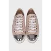 Patent leather sneakers with a metal toe cap