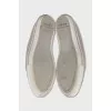 Patent leather sneakers with a metal toe cap