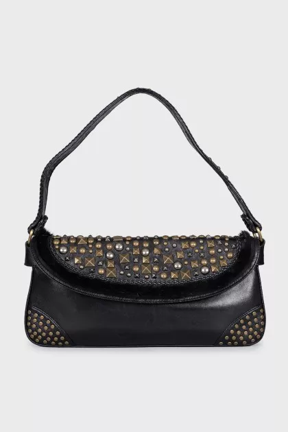 Leather bag decorated with rivets and fur