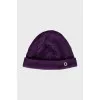 Knitted hat in purple color
