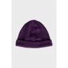 Knitted hat in purple color