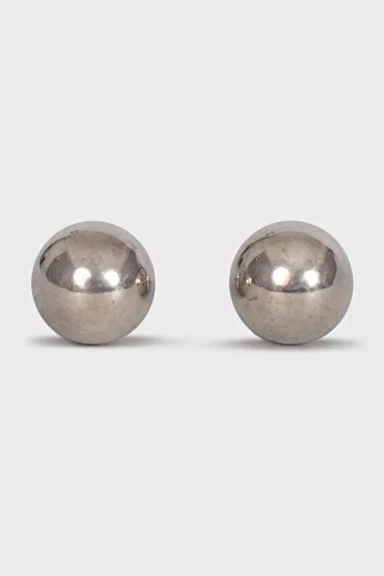 Silver earrings in the shape of spheres