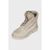 Leather lace-up boots with perforations
