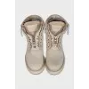 Leather lace-up boots with perforations