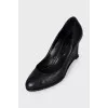 Black leather wedge shoes