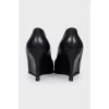 Black leather wedge shoes