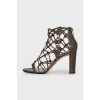 Leather heeled sandals with a braided upper
