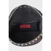 Leather belt bag decorated with studs