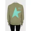 Green sweatshirt with a signature print