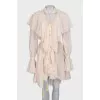 Dress with ruffles and tassels