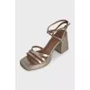 Gold-color trapeze heel sandals