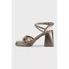 Gold-color trapeze heel sandals