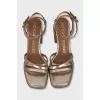 Gold-color trapeze heel sandals