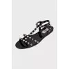 Sandals decorated with golden spikes