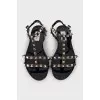 Sandals decorated with golden spikes