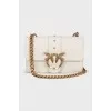 White bag with gold hardware