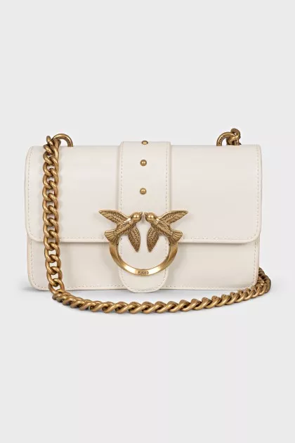 White bag with gold hardware
