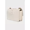 White bag with gold hardware