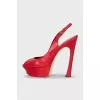 Red leather sandals with a figured heel