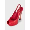 Red leather sandals with a figured heel