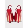 Red leather sandals with a figured heel