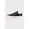 Leather sneakers with a logo on the front