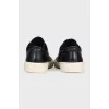 Leather sneakers with a logo on the front