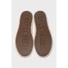 Leather sneakers with a logo on the front