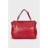 Leather bag with gold clasp
