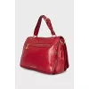 Leather bag with gold clasp