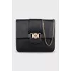 Leather bag with chain and logo