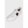 Men's leather sneakers decorated with patches