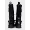 Patent leather boots decorated with a chain